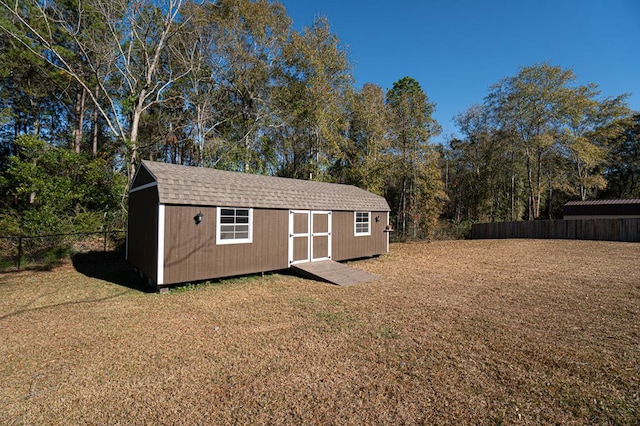 view of outdoor structure with a lawn