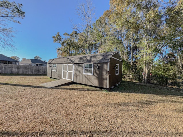 view of outbuilding featuring a yard