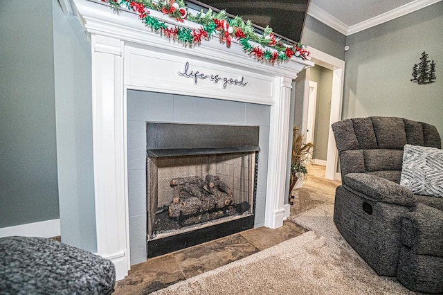 room details with carpet flooring, crown molding, and a fireplace