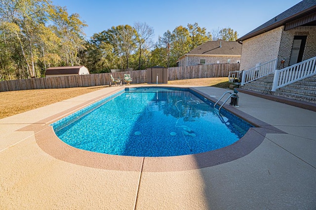 view of swimming pool with a patio