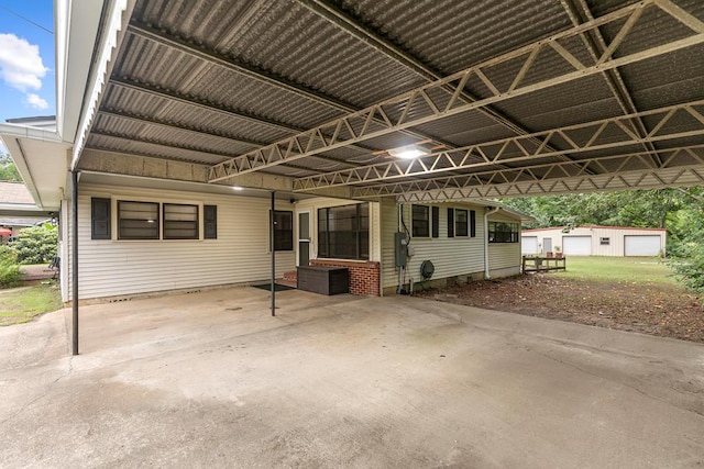 6970 Walden Dr, Kinsey, AL 36303 - exterior space featuring an attached carport and an outdoor structure