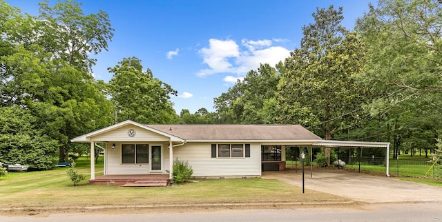 6970 Walden Dr, Kinsey, AL 36303 - view of front of house with driveway, a carport, and a porch