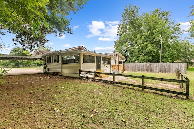 6970 Walden Dr, Kinsey, AL 36303 - view of front of property with a sunroom and a carport