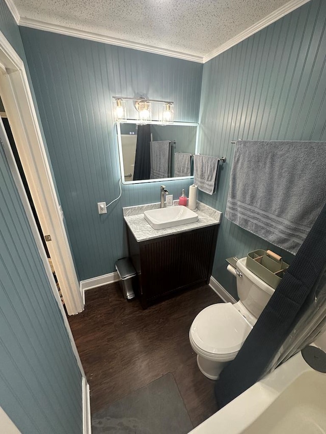 6970 Walden Dr, Kinsey, AL 36303 - bathroom with ornamental molding, wood finished floors, vanity, wooden walls, and a textured ceiling