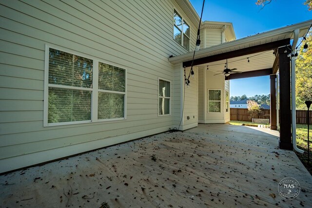 view of patio featuring ceiling fan