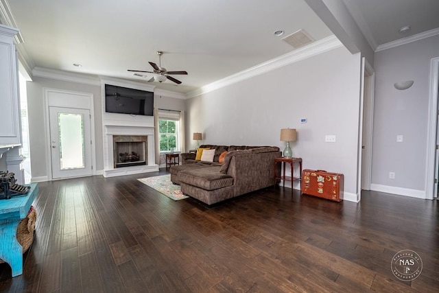 living room featuring ceiling fan, dark hardwood / wood-style flooring, and crown molding