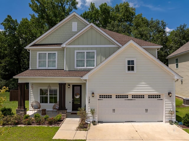 view of front of home featuring covered porch and a garage