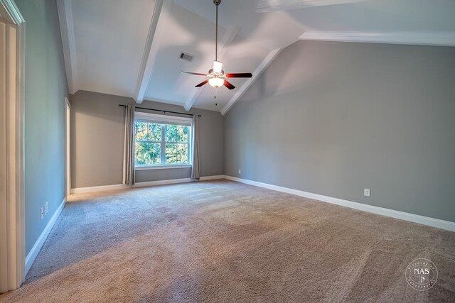 empty room featuring lofted ceiling with beams, ceiling fan, and carpet floors