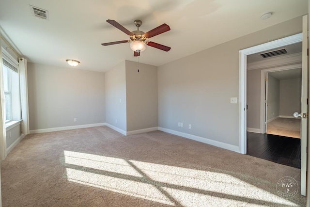 carpeted empty room with ceiling fan