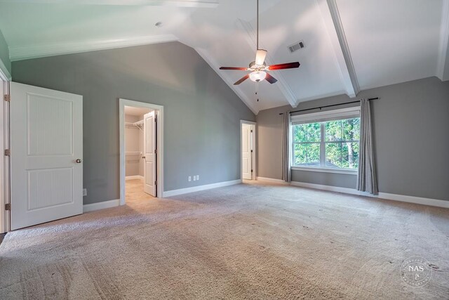 interior space with light carpet, lofted ceiling with beams, and ceiling fan