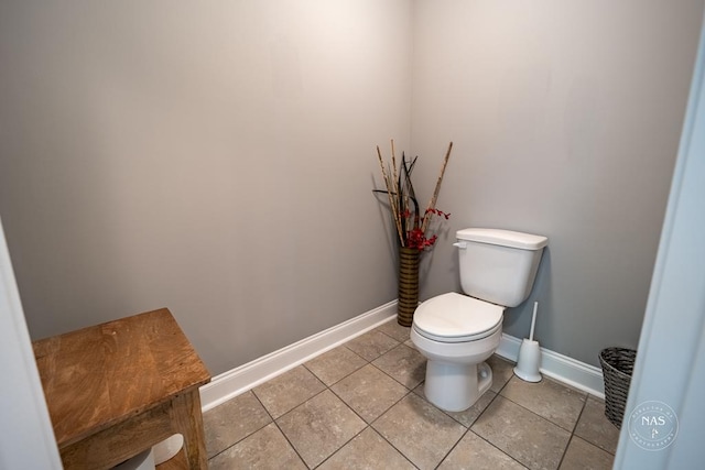 bathroom featuring tile patterned flooring and toilet