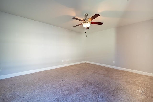 empty room featuring carpet floors and ceiling fan