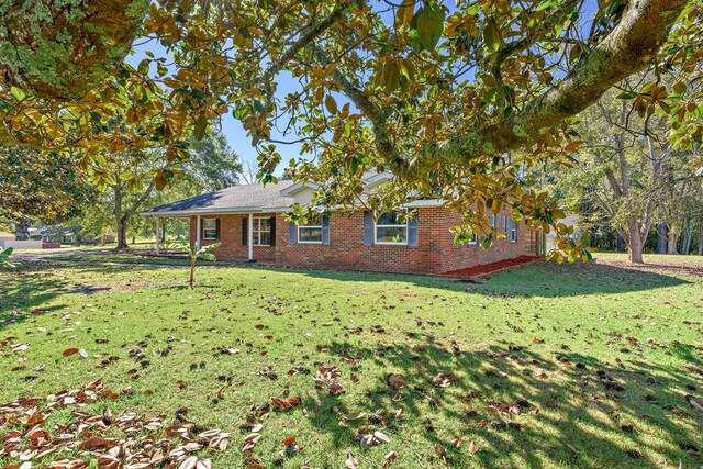 1303 Highland Dr, Elba, AL 36323 - view of front of house with brick siding and a front lawn