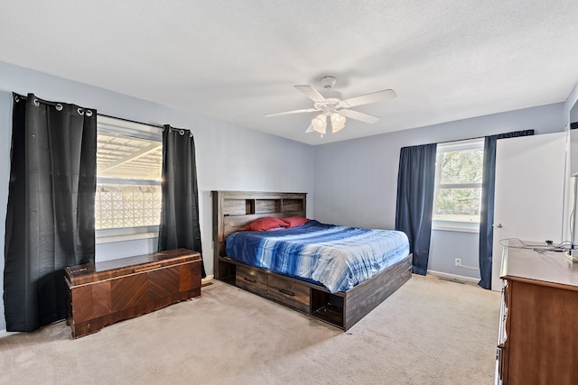 1303 Highland Dr, Elba, AL 36323 - bedroom featuring carpet floors, ceiling fan, and a textured ceiling
