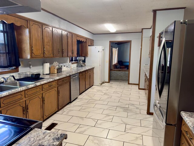 1303 Highland Dr, Elba, AL 36323 - kitchen featuring stainless steel appliances, light marble finish flooring, light countertops, brown cabinetry, and ornamental molding