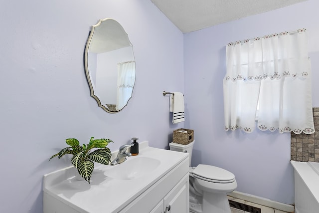 1303 Highland Dr, Elba, AL 36323 - full bathroom with vanity, a tub to relax in, and tile patterned flooring