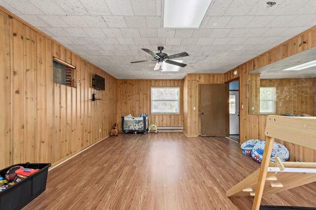 1303 Highland Dr, Elba, AL 36323 - entryway with light wood-style flooring, wooden walls, and ceiling fan