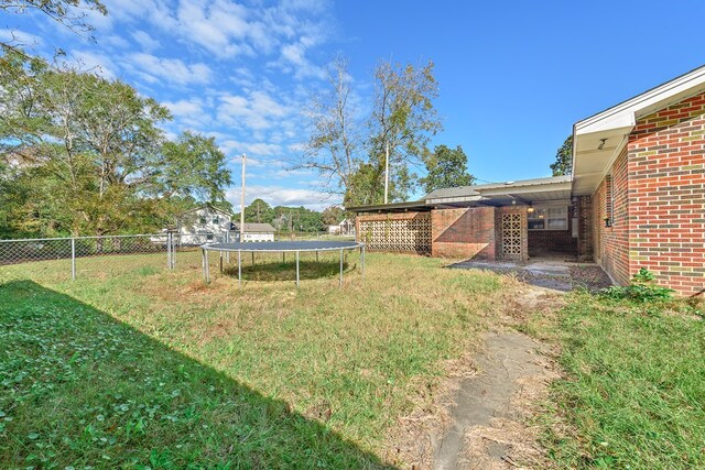 1303 Highland Dr, Elba, AL 36323 - view of yard with a trampoline