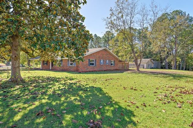 1303 Highland Dr, Elba, AL 36323 - view of side of property with brick siding and a yard