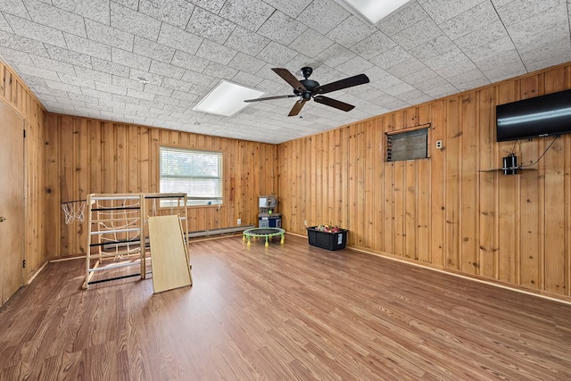 1303 Highland Dr, Elba, AL 36323 - unfurnished room featuring wood finished floors, a ceiling fan, and wood walls