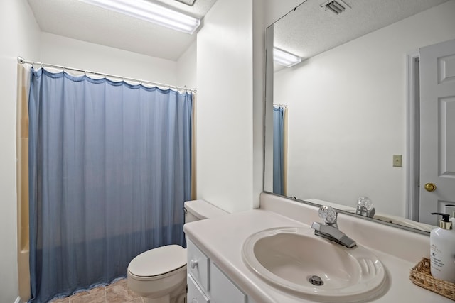 full bathroom with shower / tub combo with curtain, vanity, a textured ceiling, and toilet