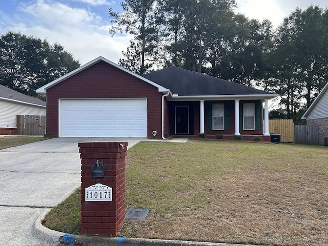 single story home with a garage and a front lawn