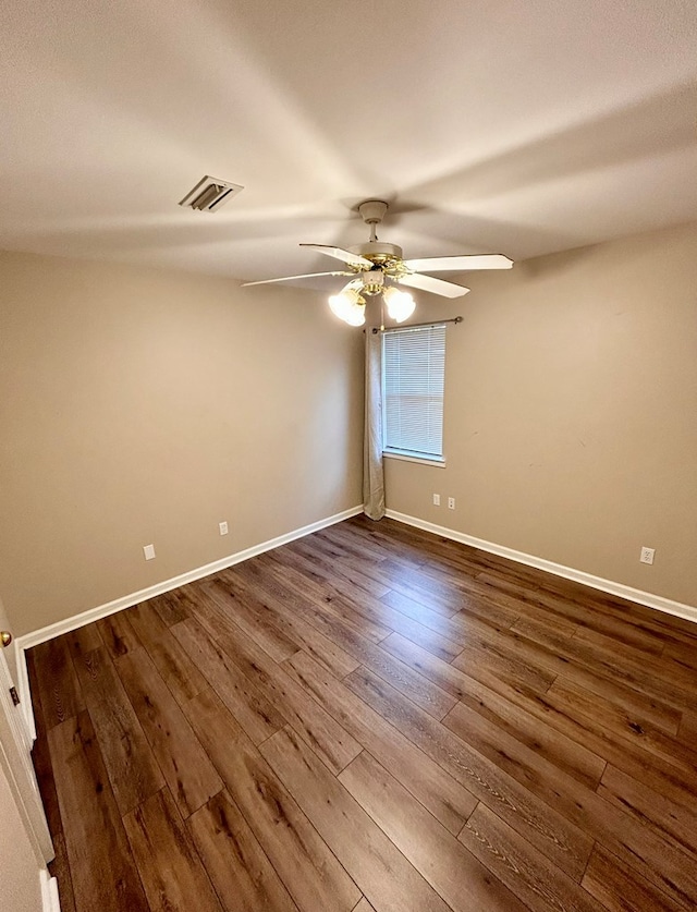 empty room with ceiling fan and hardwood / wood-style floors