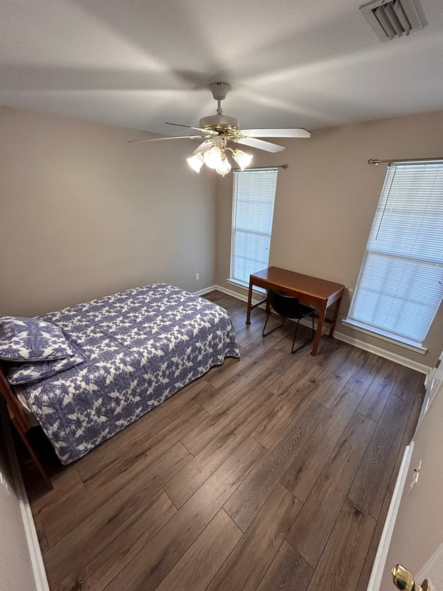 bedroom with hardwood / wood-style floors and ceiling fan