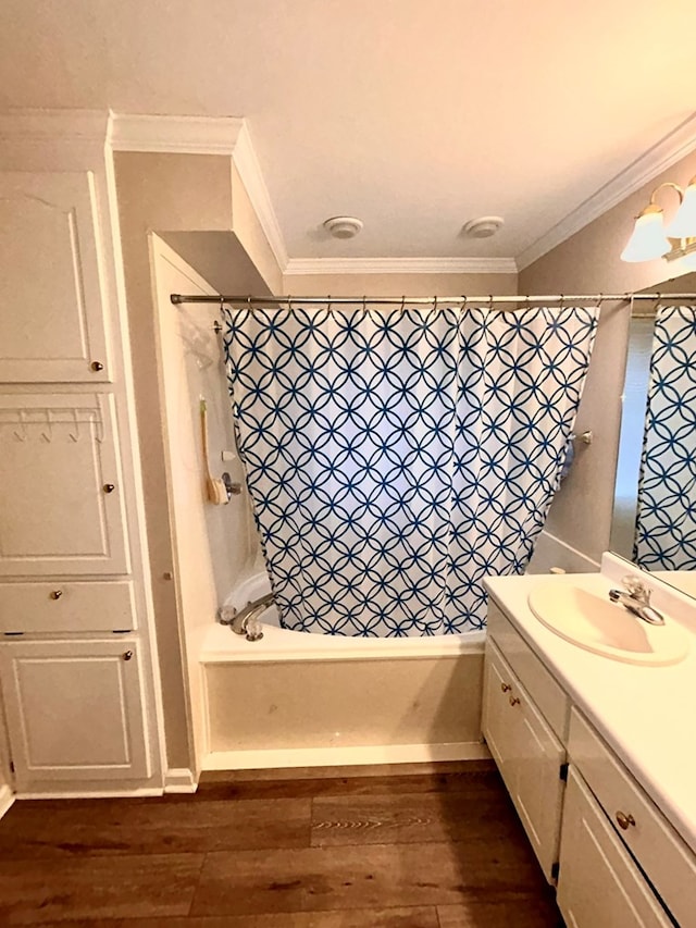 bathroom featuring shower / tub combination, vanity, hardwood / wood-style flooring, and crown molding