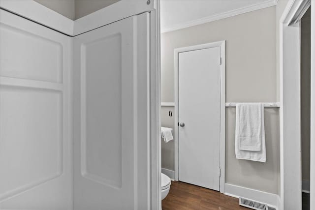 1301 S Bell St, Dothan, AL 36301 - bathroom with wood finished floors, ornamental molding, and toilet