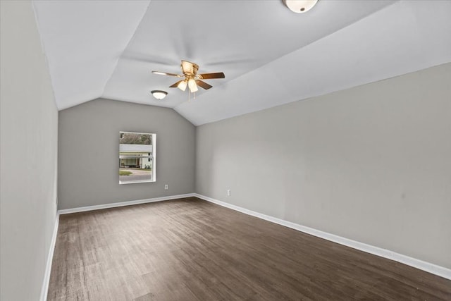 1301 S Bell St, Dothan, AL 36301 - additional living space featuring ceiling fan, dark wood-style flooring, lofted ceiling, and baseboards