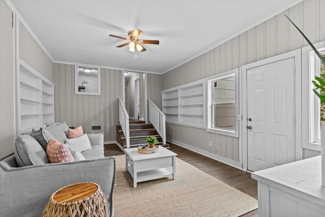 1301 S Bell St, Dothan, AL 36301 - living room featuring dark wood-style floors, ceiling fan, ornamental molding, stairs, and baseboards