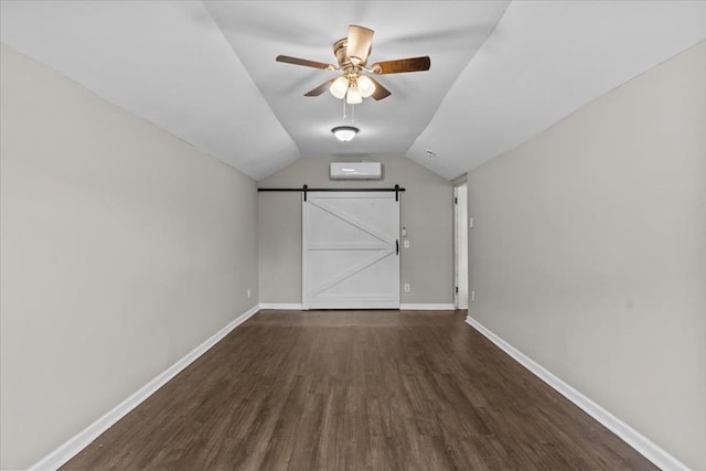 1301 S Bell St, Dothan, AL 36301 - bonus room with a barn door, ceiling fan, wood finished floors, baseboards, and vaulted ceiling