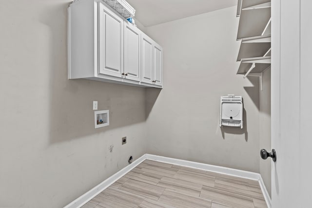 laundry room featuring electric dryer hookup, baseboards, cabinet space, and hookup for a washing machine