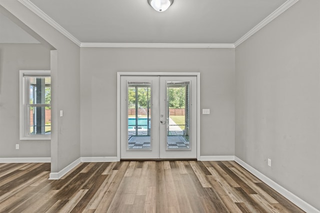 doorway to outside featuring french doors, wood finished floors, and a wealth of natural light