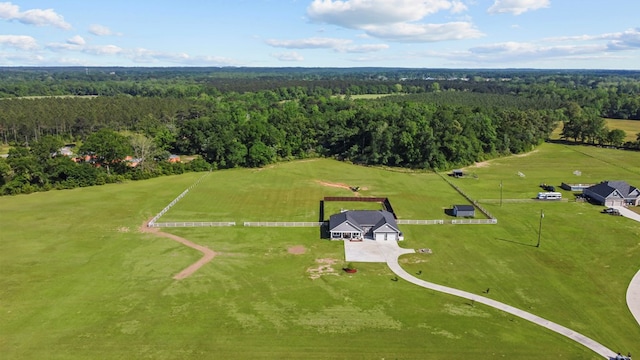 bird's eye view featuring a wooded view