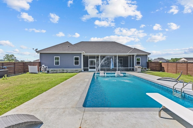 view of swimming pool featuring a lawn, a fenced backyard, a patio, a fenced in pool, and a sunroom