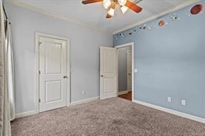 unfurnished bedroom with carpet floors and baseboards