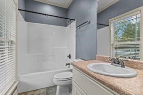 bathroom featuring toilet, bathing tub / shower combination, and vanity