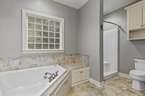 bathroom with baseboards, a shower stall, toilet, and a bath