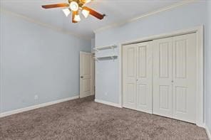 unfurnished bedroom featuring baseboards, a closet, ornamental molding, and carpet flooring