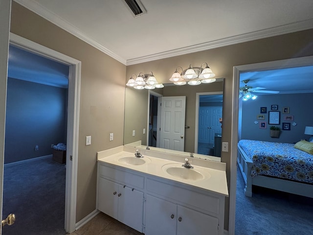 bathroom with connected bathroom, crown molding, a sink, and double vanity
