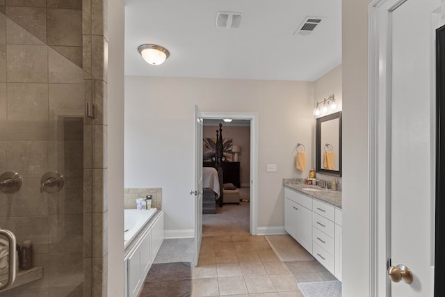 bathroom featuring vanity, tile patterned floors, and independent shower and bath