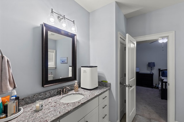 bathroom featuring ceiling fan and vanity