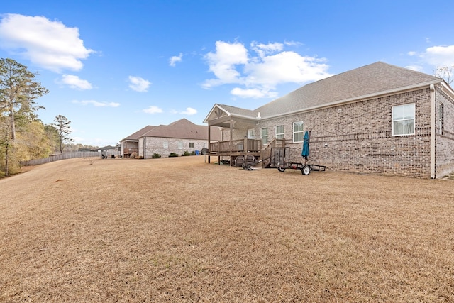 view of yard with a wooden deck