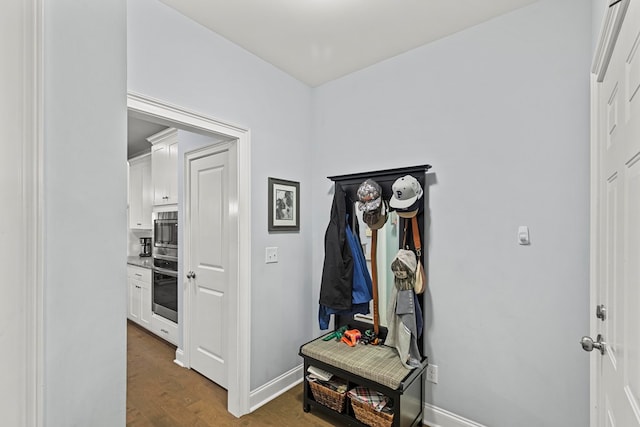 hallway with dark wood-type flooring