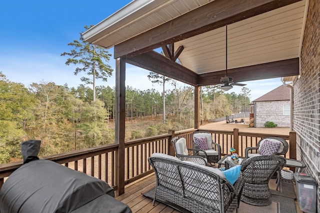 wooden terrace featuring ceiling fan