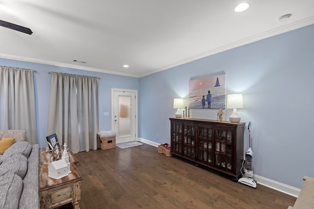 interior space with dark wood-type flooring and ornamental molding