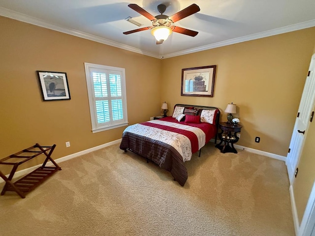 carpeted bedroom with ceiling fan and ornamental molding