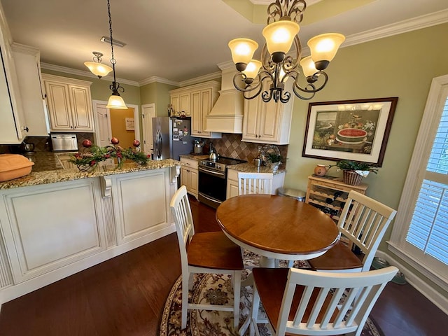 dining space with ornamental molding, dark hardwood / wood-style floors, and a notable chandelier